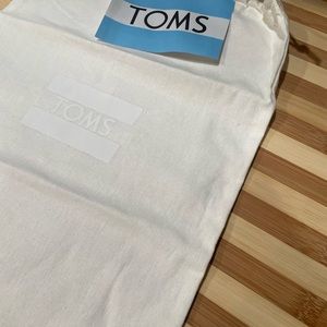 TOMS dust bag, 11 inches by 15 inches as pictured, sticker included, never used